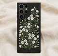 Phone case with floral design on a beige fabric background