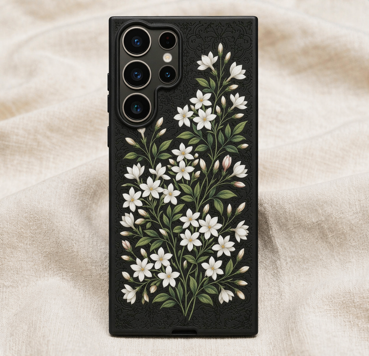 Phone case with floral design on a beige fabric background