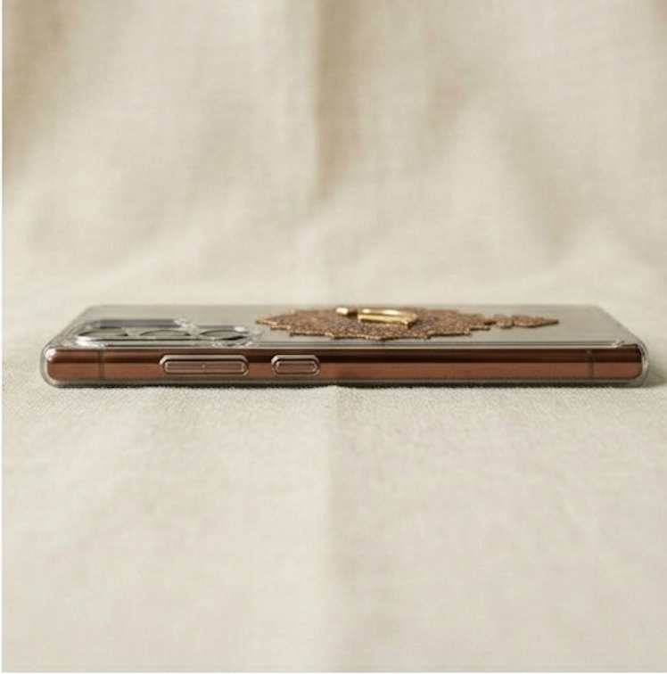 Phone case with decorative elements on a beige fabric background
