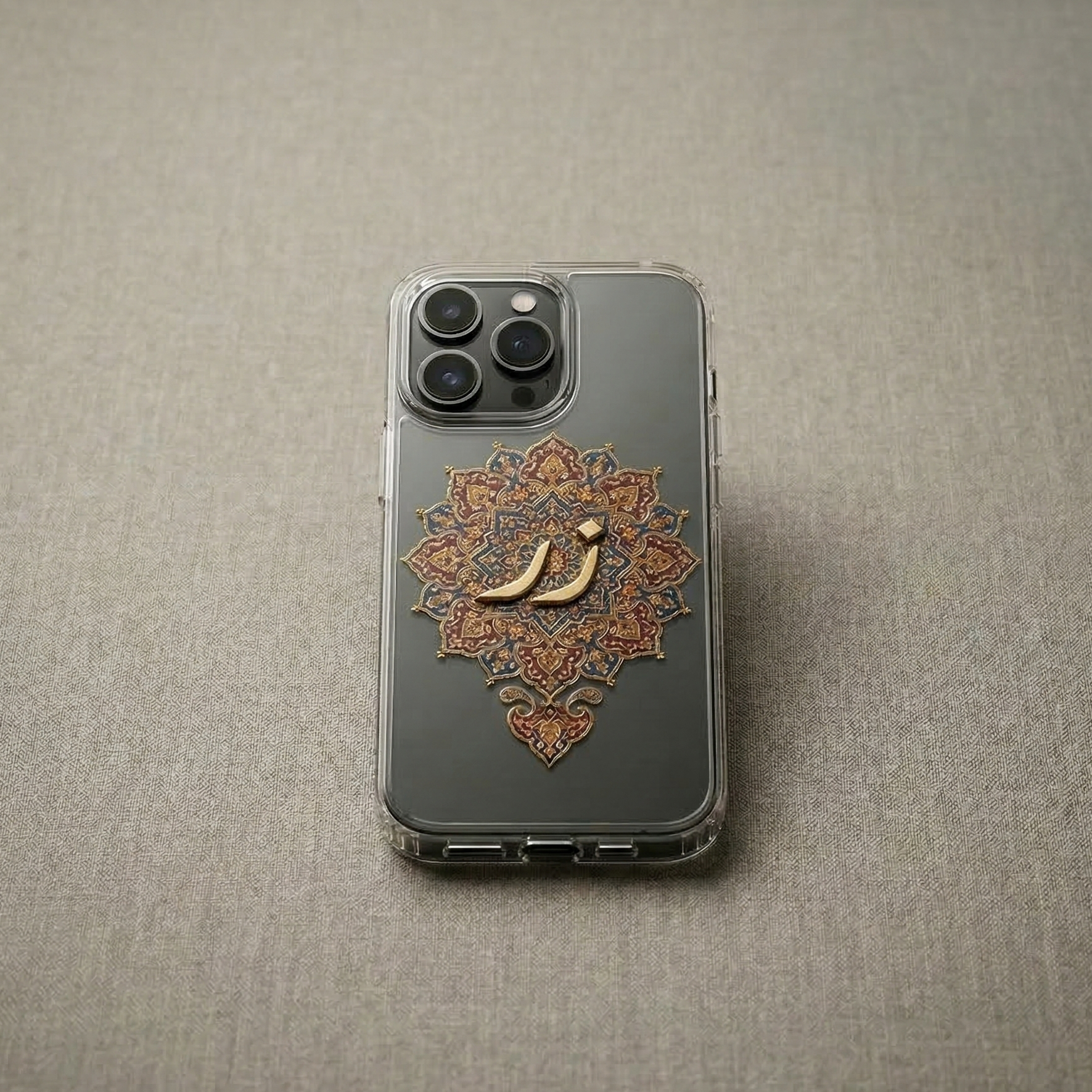 The case is made of premium clear silicone . In the center, there is a bold, 3D raised metallic gold chrome Urdu calligraphy of the word "Zar" (زر) behind a traditional design. 