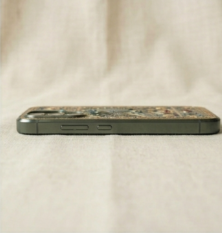 Phone case with decorative pattern on a beige fabric background