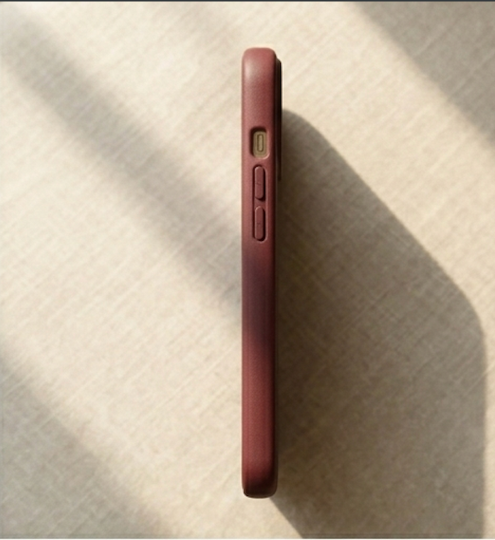 Maroon Phone case on a textured surface